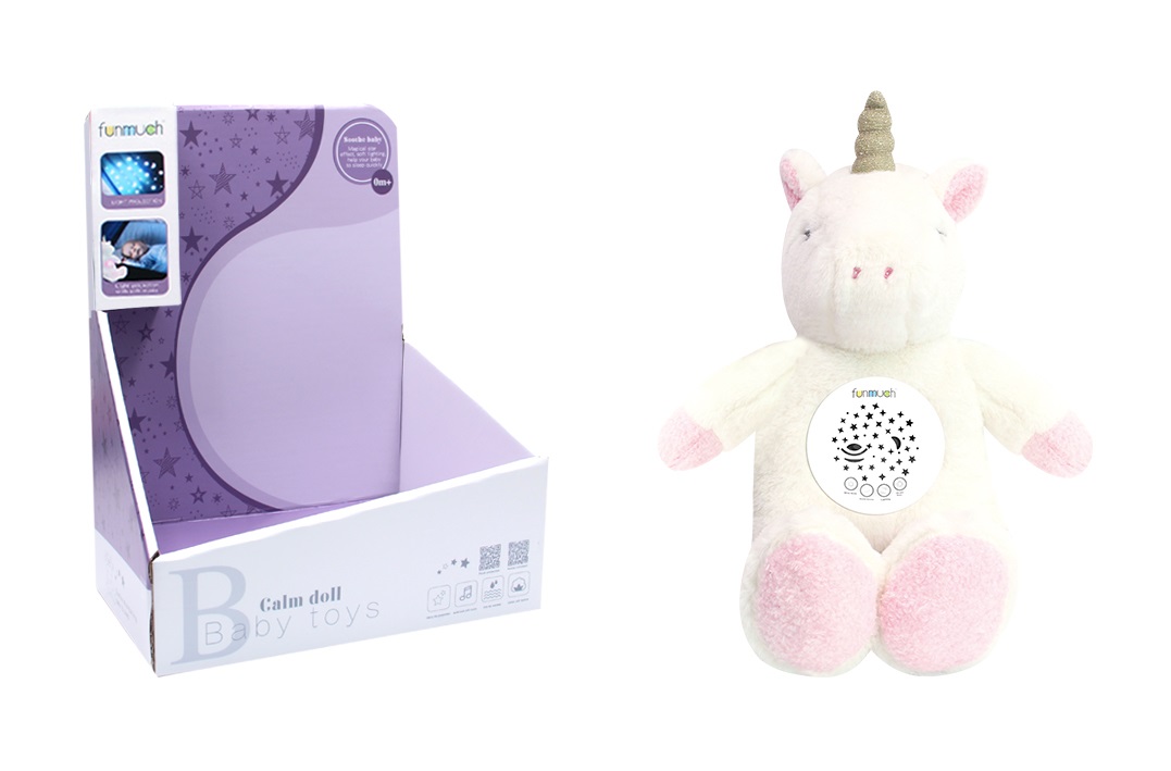 בובת חד קרן יושבת עם מקרן כוכבים וצלילים