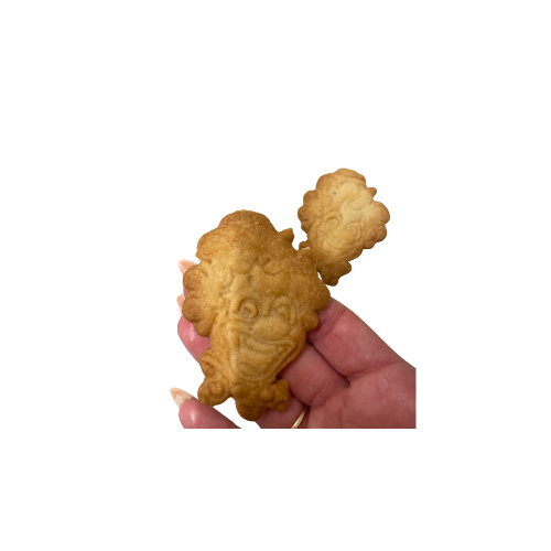 חותכן ליצן מחייך עם כובע