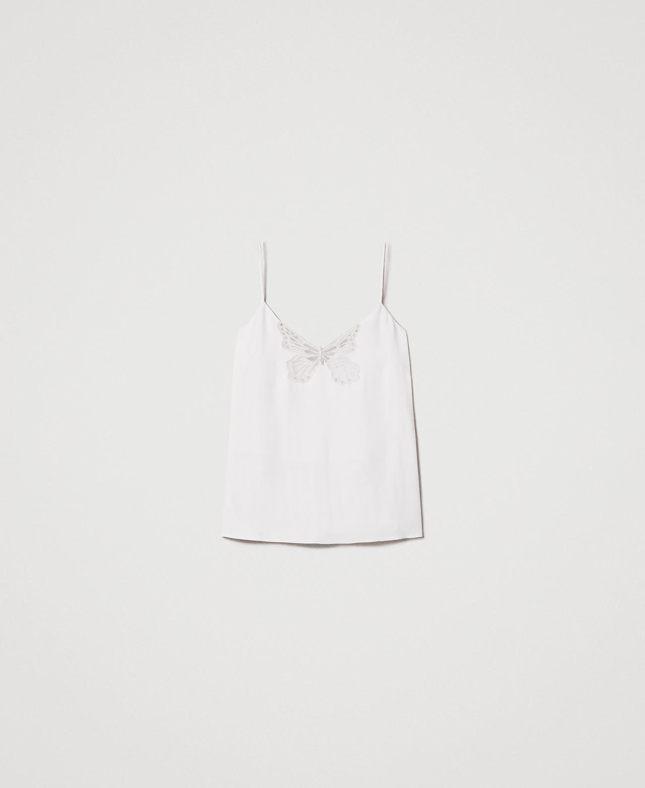 Top with an embroidered butterfly