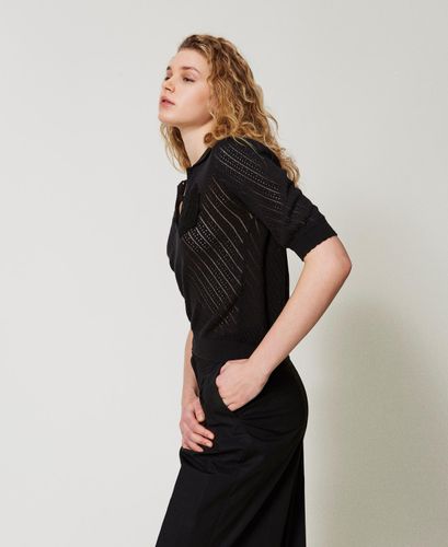 Knit polo shirt with embroidered patch
