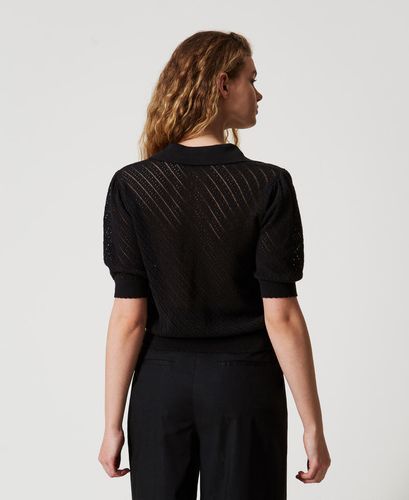Knit polo shirt with embroidered patch