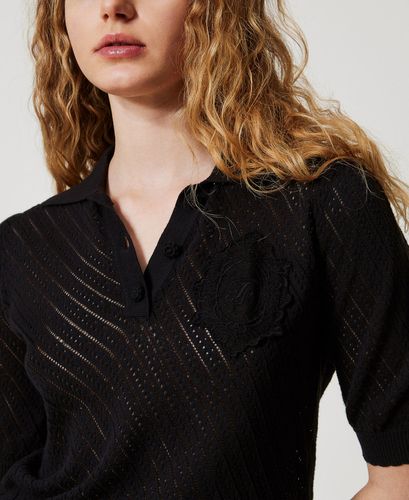 Knit polo shirt with embroidered patch