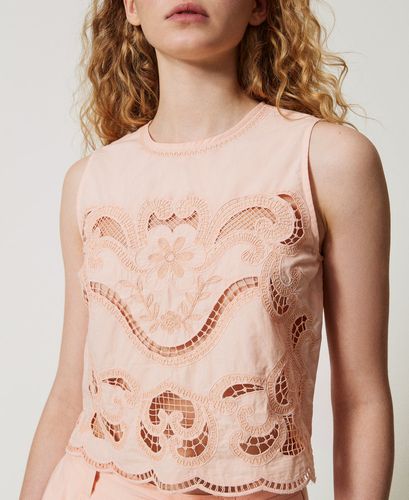 Top with openwork embroidery
