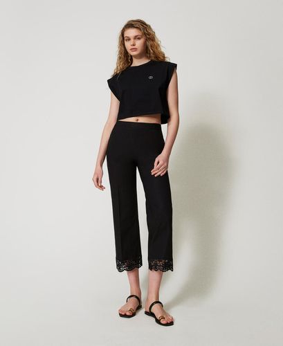 Cropped t-shirt with a rhinestone Oval T logo Black