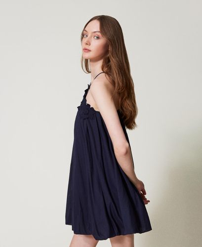 Short muslin dress with embroidered flowers