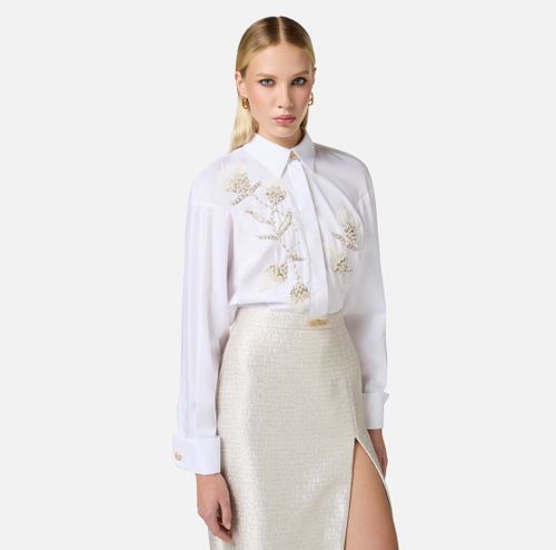 Cotton poplin shirt with floral embroideries