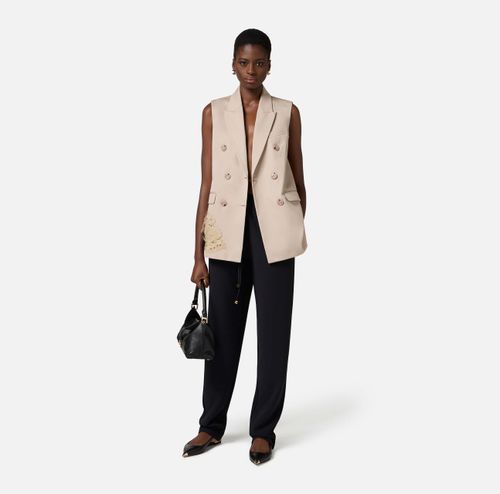 Cotton gabardine waistcoat with embroidered flower
