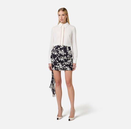 Skirt in printed georgette fabric with sash belt