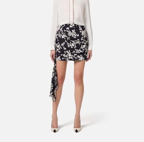 Skirt in printed georgette fabric with sash belt
