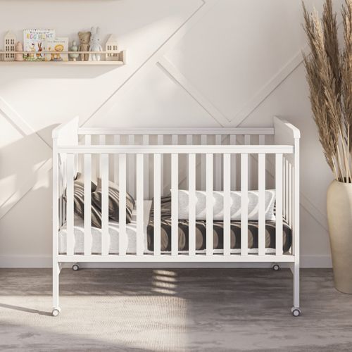 מיטת תינוק מעץ בוק עם דופן עולה/יורדת ריילי - לבן