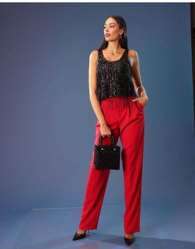 Tulle top embroidered with sequin fringes
