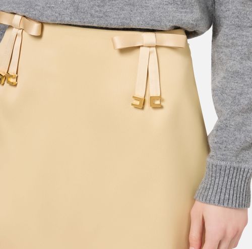 Satin miniskirt with bows‏