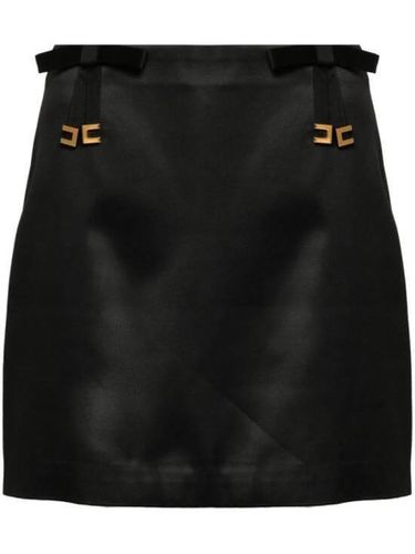 Satin miniskirt with bows‏