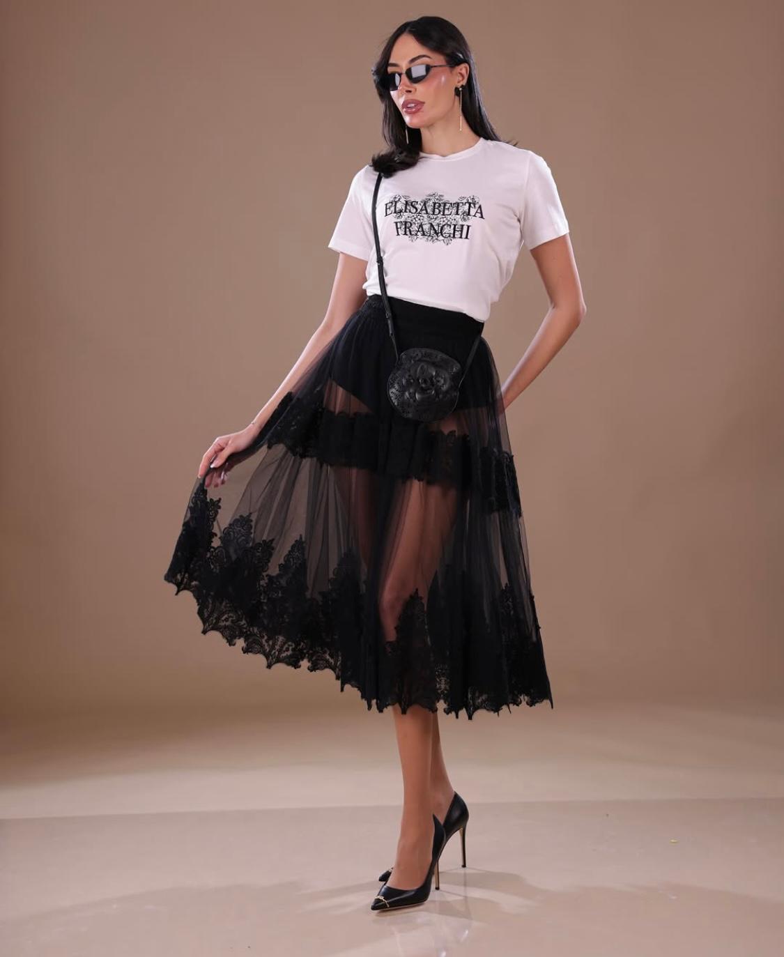 Skirt in tulle fabric with lace decorations Skirt in tulle fabric with lace decorations