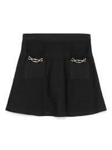 Knit miniskirt with Oval T clasps