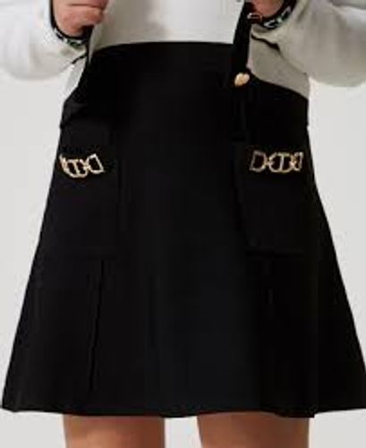 Knit miniskirt with Oval T clasps