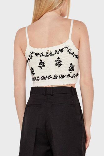 Knit top with floral embroidery