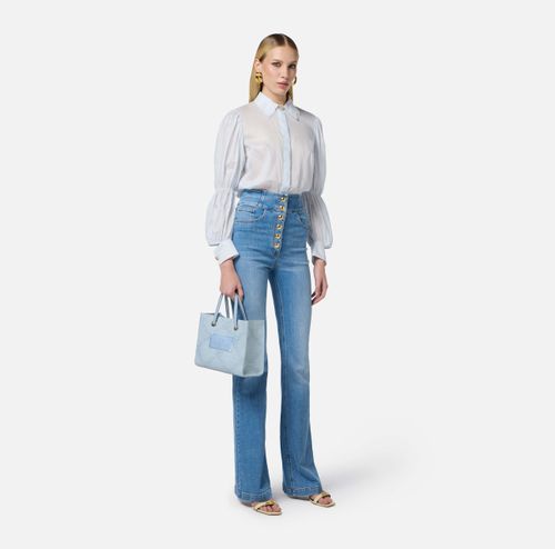 High-waist jeans with logo buttons