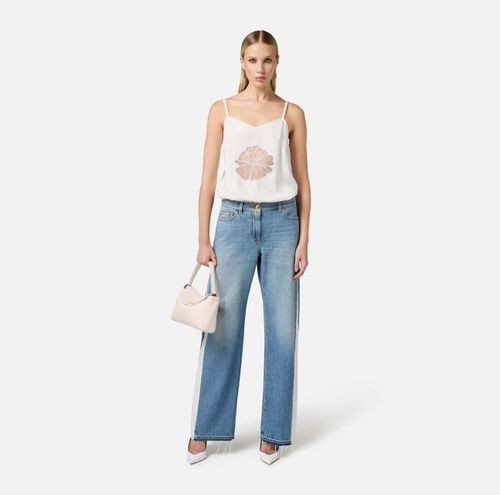 Trompe-l'oeil jumpsuit in crêpe and denim