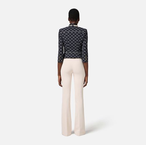 Crêpe bell-bottom trousers with logo plaque