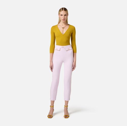 Trousers in crêpe fabric with piping and jewelled horsebit