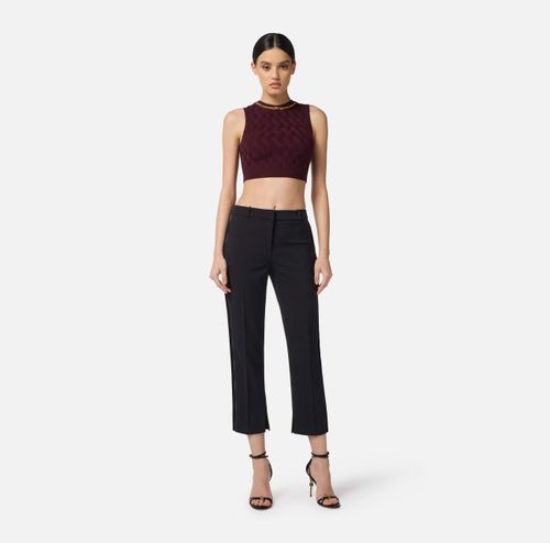 Trousers in lightweight crêpe fabric with tuxedo details