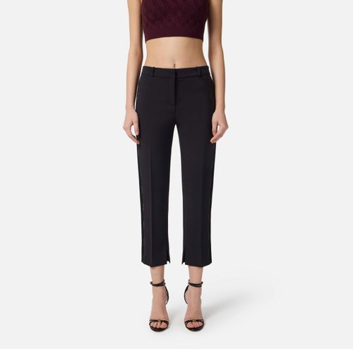 Trousers in lightweight crêpe fabric with tuxedo details