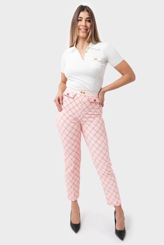 Trousers in crêpe fabric with diamond print