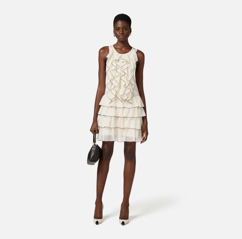 Dress in knit fabric with ruffles and flounces