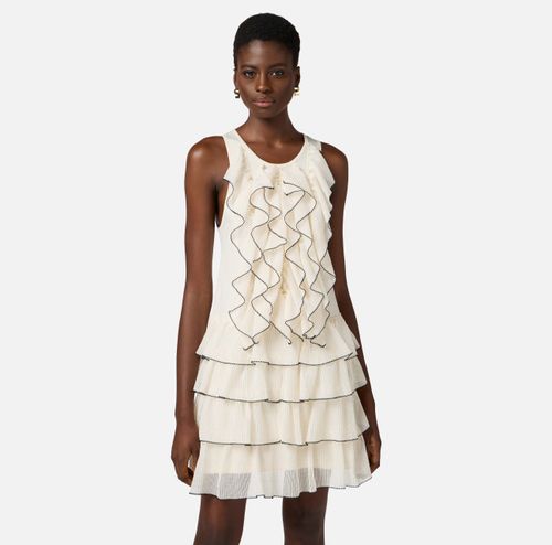 Dress in knit fabric with ruffles and flounces