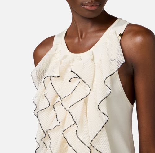 Dress in knit fabric with ruffles and flounces