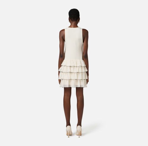 Dress in knit fabric with ruffles and flounces