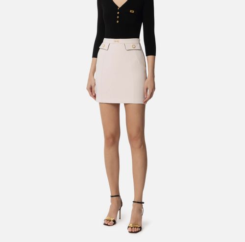 Miniskirt in crêpe fabric with piping and jewelled horsebit