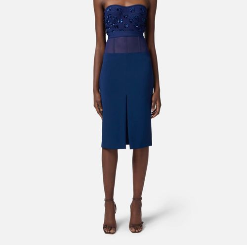 Crêpe skirt with tulle peplum