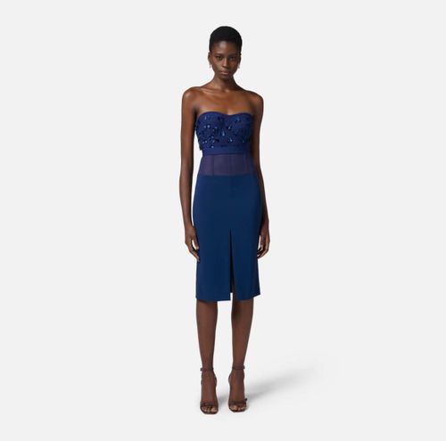 Crêpe skirt with tulle peplum