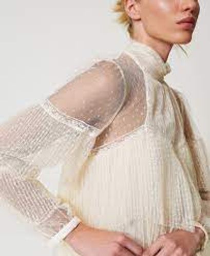 Tulle blouse with pleated flounces