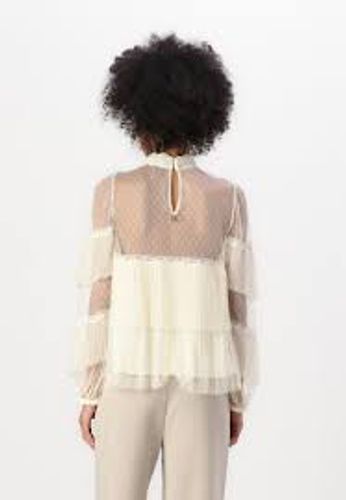 Tulle blouse with pleated flounces