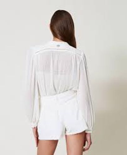 Georgette blouse with pleats and embroidery