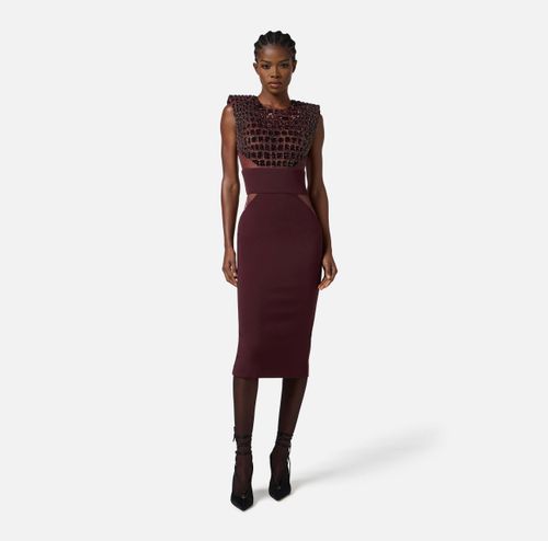 Dress in lightweight crêpe and tulle fabrics with crocodile-effect embroideries
