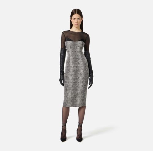 Dress in tulle, satin and crêpe with python print