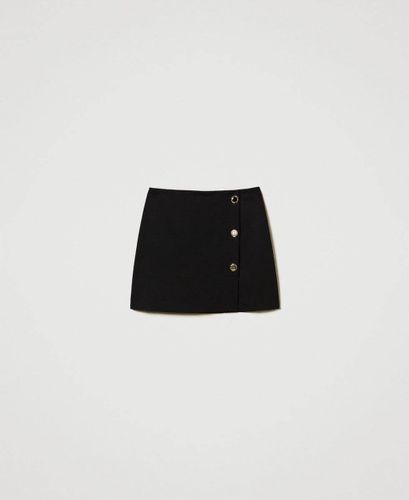 Miniskirt with jewel buttons