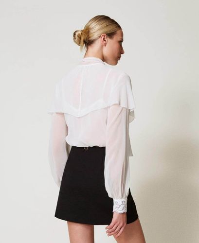 Miniskirt with jewel buttons