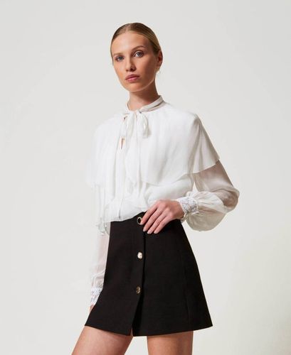 Miniskirt with jewel buttons