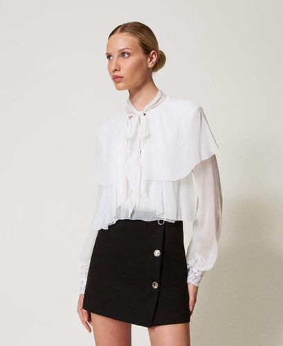 Miniskirt with jewel buttons