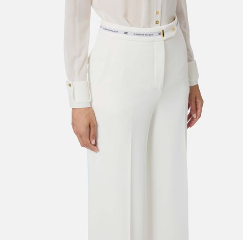 Trousers in lightweight crêpe fabric with logo ribbon