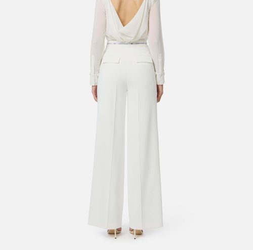 Trousers in lightweight crêpe fabric with logo ribbon