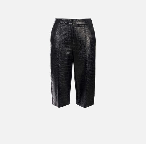 Trousers with crocodile print