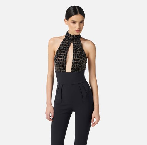 Jumpsuit in tulle and crêpe fabrics with crocodile embroideries