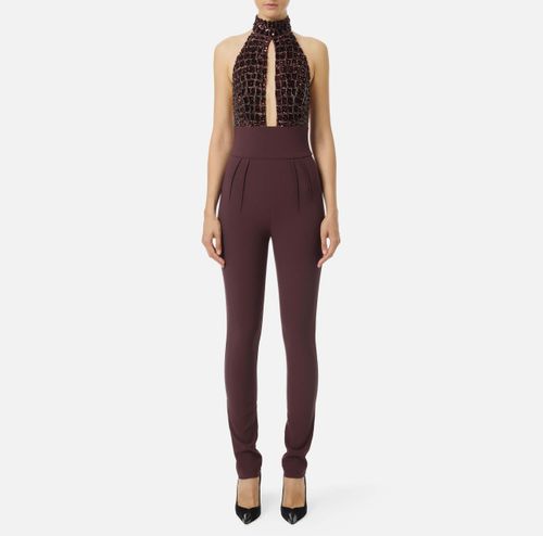 Jumpsuit in tulle and crêpe fabrics with crocodile embroideries