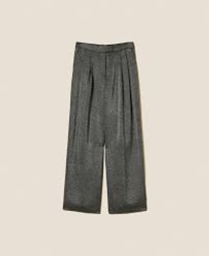 Palazzo trousers with laminated print